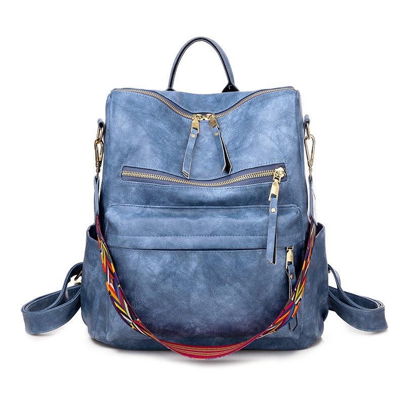 blue pu womens casual backpack with dual front zipper pockets and patterned shoulder strap