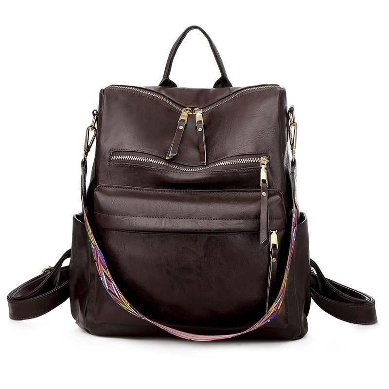coffee brown pu womens backpack with gold tone zippers front organizer pockets and woven shoulder strap