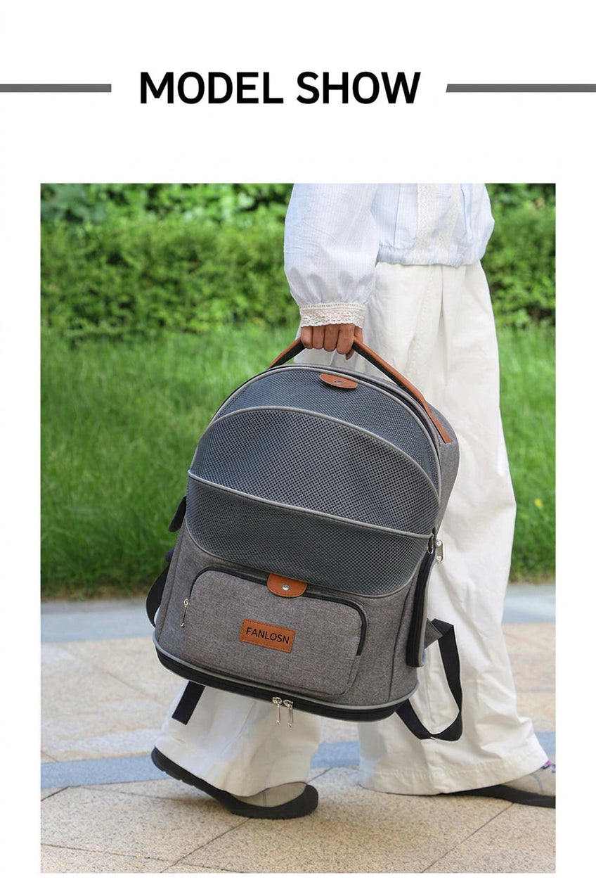 woman carrying gray pet travel backpack by its orange top handle outdoors