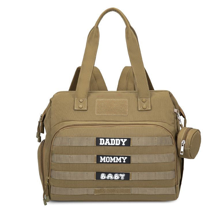 khaki tactical diaper bag tote with horizontal webbing rows front zipper pocket and side pacifier holder