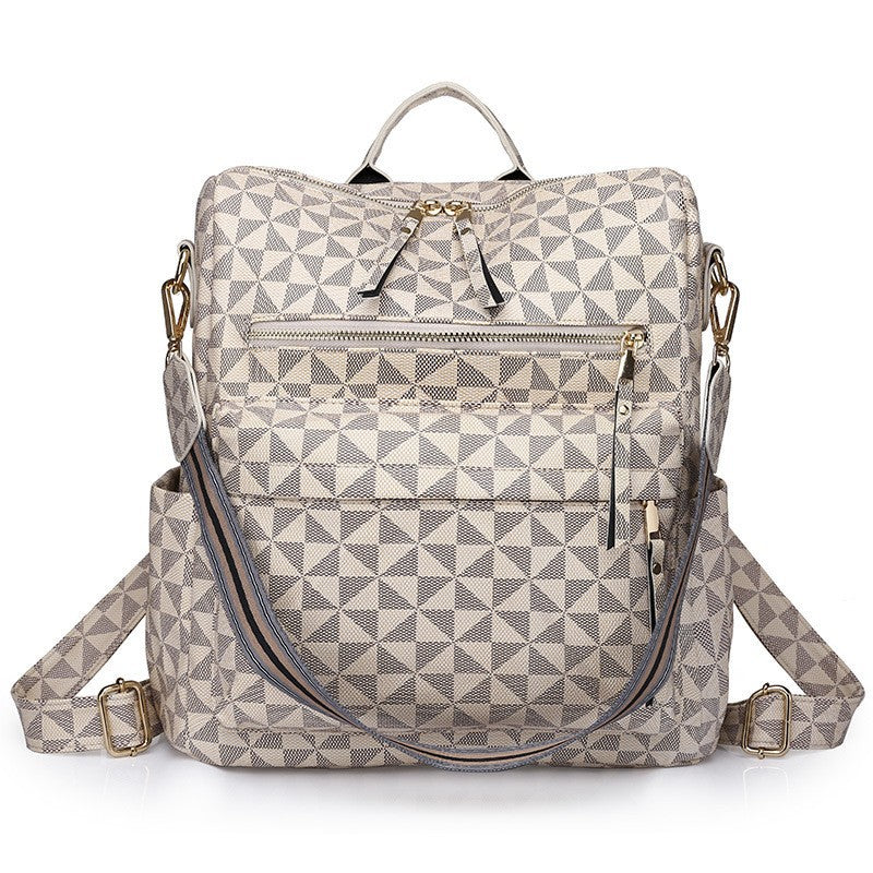 beige triangular grid patterned womens backpack with front storage pockets and top handle