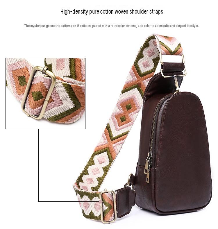 wide geometric woven shoulder strap on brown sling bag with adjustable metal buckle and pink olive green and white pattern