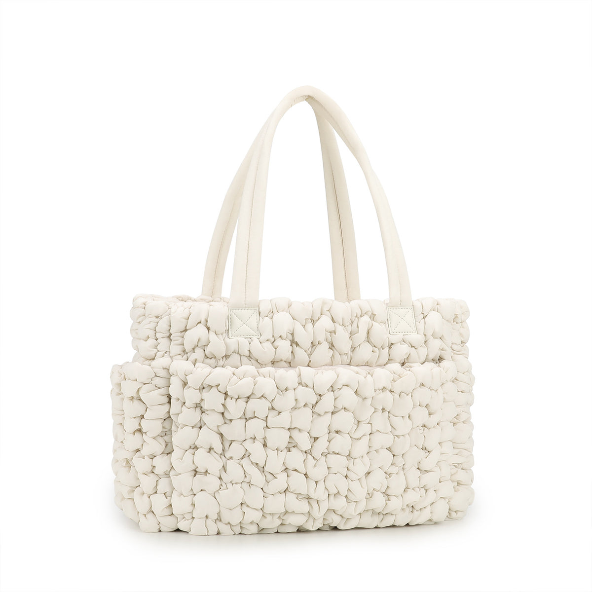 beige soft textured quilted diaper tote with large storage area and reinforced carry handles