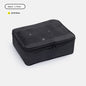 black no 2 compression packing cube measuring 34 x 12 x 27 cm with mesh top panel