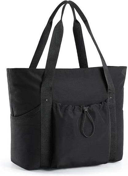black travel tote bag with long shoulder handles multiple exterior pockets and front drawstring storage