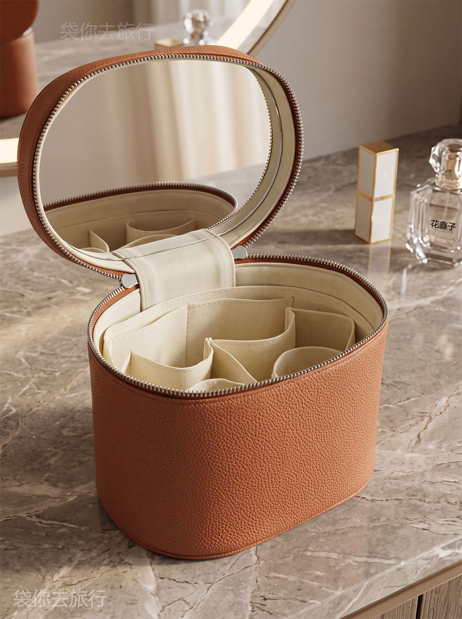brown makeup organizer case showing empty divided interior with brush holders and removable-looking compartment sections