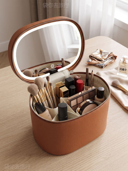 brown makeup organizer case open with mirror makeup brushes bottles and inner dividers