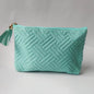 cyan velvet makeup bag with elegant quilted design