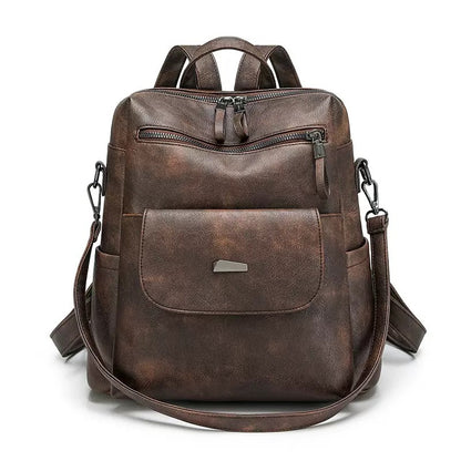 dark brown pu backpack with curved front zipper magnetic flap compartment and side pockets