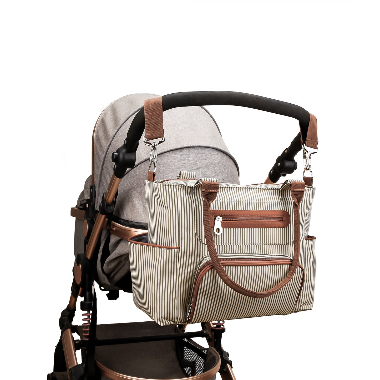Travel diaper bag attached to stroller with stroller straps
