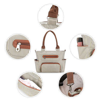 Close-up details of diaper bag tote including zipper shoulder strap bottle pocket and hardware