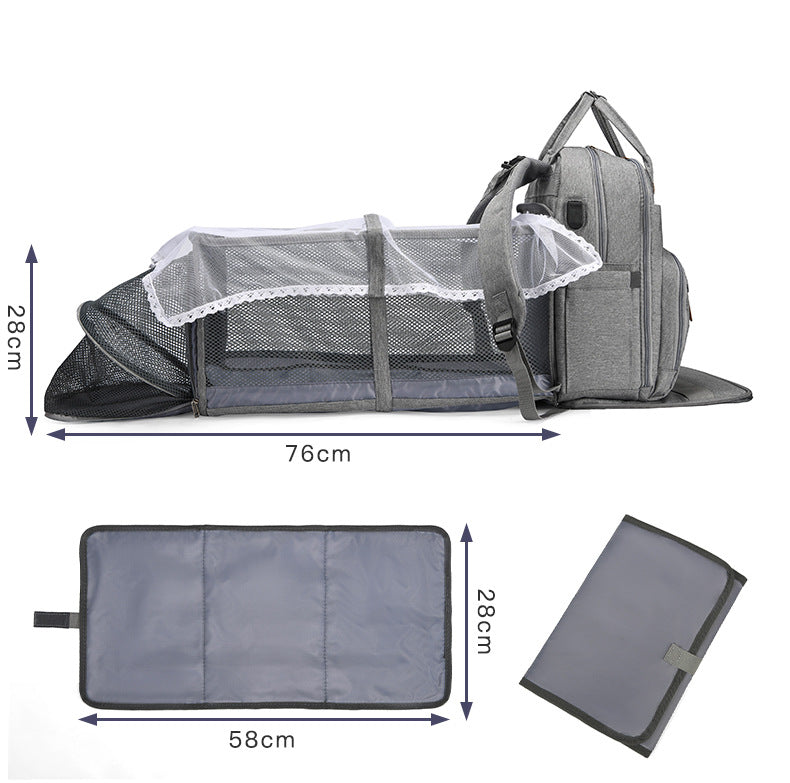 diaper backpack converts into portable baby bed