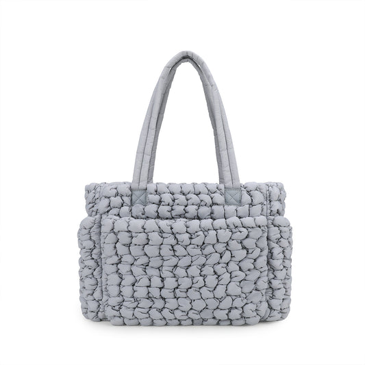 gray quilted diaper tote bag with textured nylon body and long padded handles