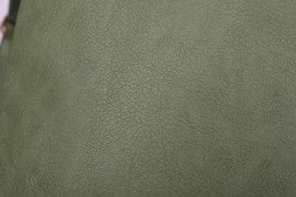 close up of green pebbled pu material surface used on the convertible womens backpack