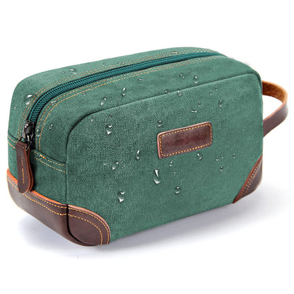 green vintage canvas toiletry bag with leather details