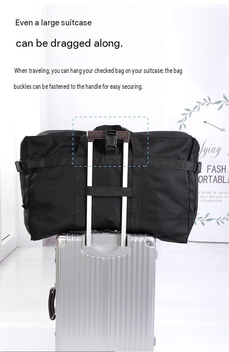 large travel bag secured to a rolling suitcase handle with rear webbing for easier luggage transport