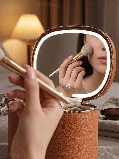 person applying makeup using an open illuminated led mirror attached to a cosmetic organizer case