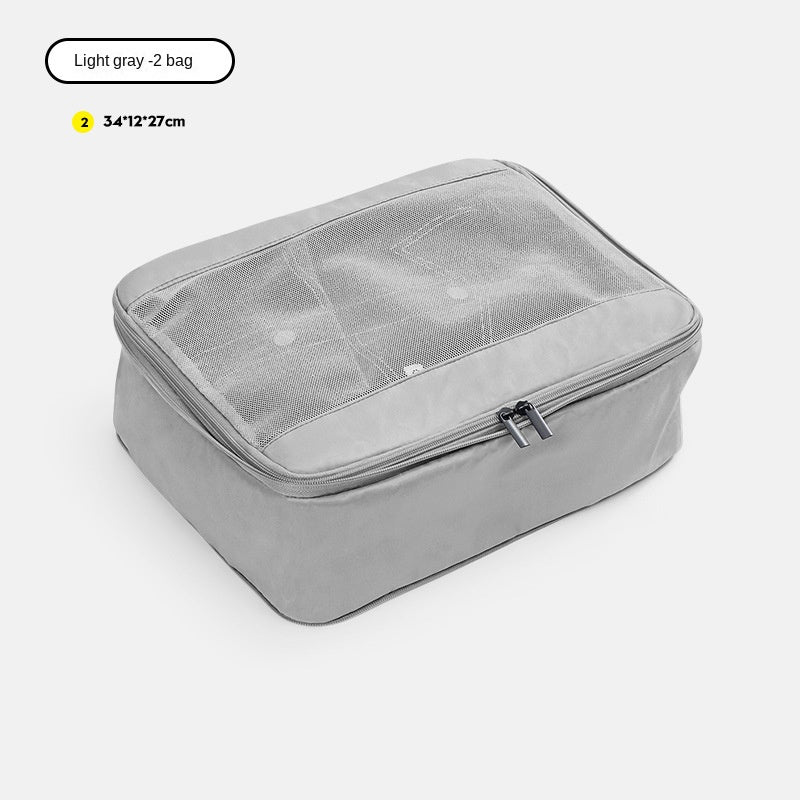 light gray no 2 compression packing cube measuring 34 x 12 x 27 cm with mesh top
