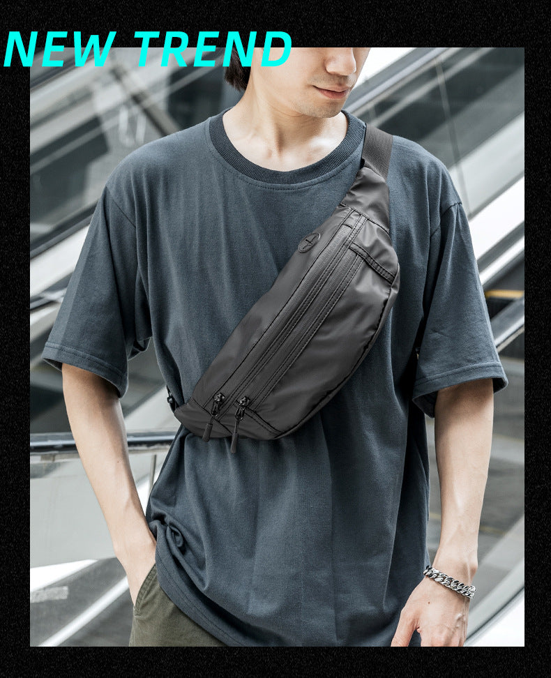 men's coated waist bag worn across the chest with multiple front zipper compartments