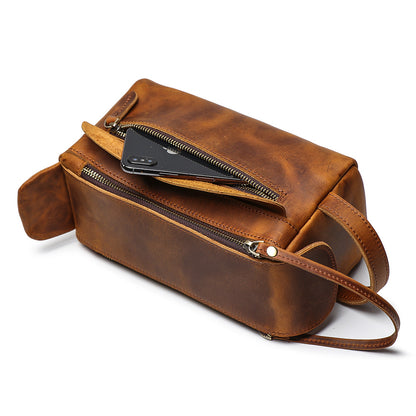 men's leather toiletry bag with travel storage compartment and zipper closure