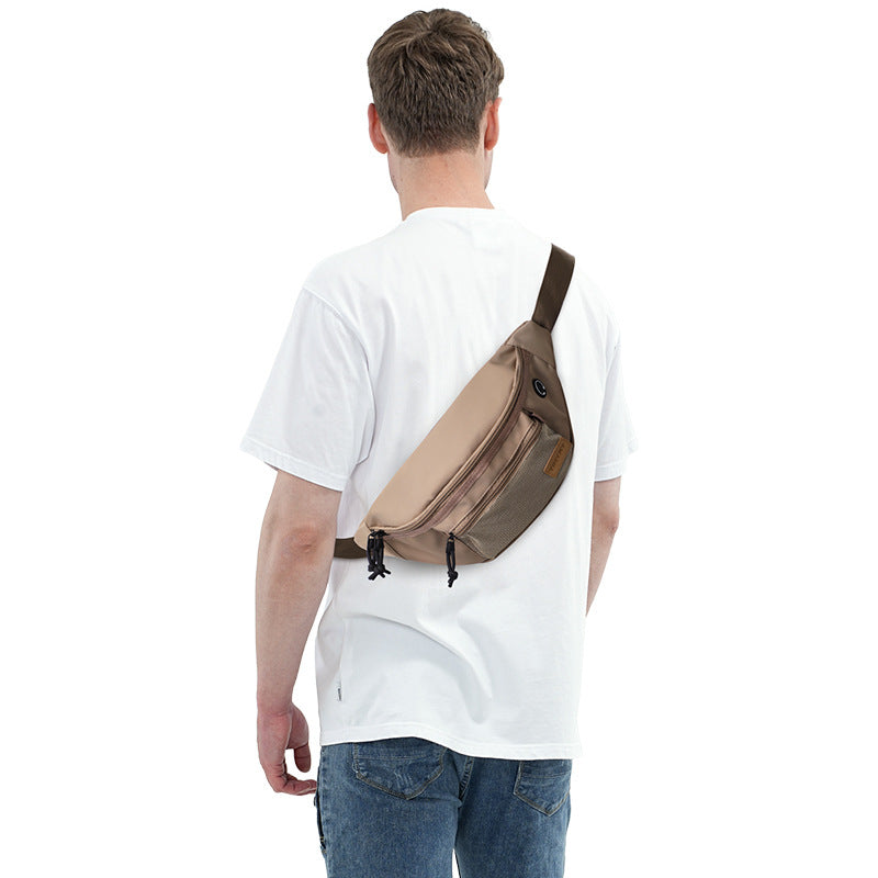 men's waist bag worn across the back as a compact crossbody bag