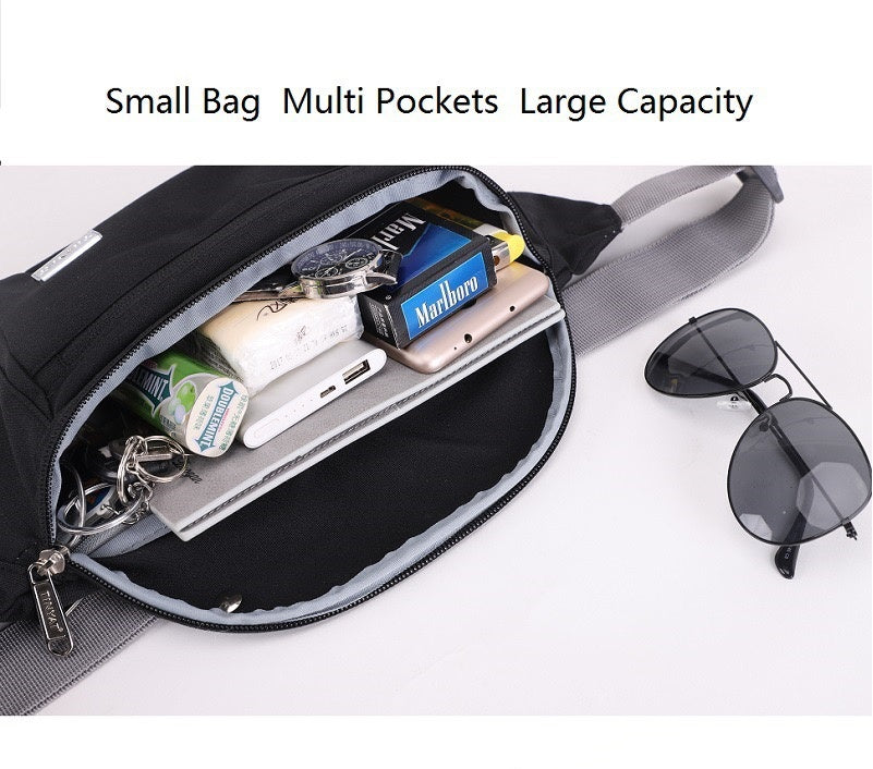 open multi pocket waist bag showing spacious main compartment holding phone power bank wallet keys and other small travel items