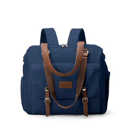navy blue convertible diaper bag tote backpack with brown handles front organizer flap and side pockets