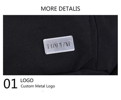 close up of rectangular silver metal logo plate on black nylon waist bag showing customizable branding position