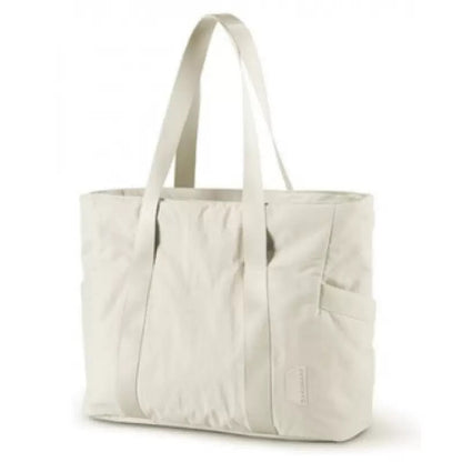 off white travel tote bag with long shoulder handles side pockets and front storage panel