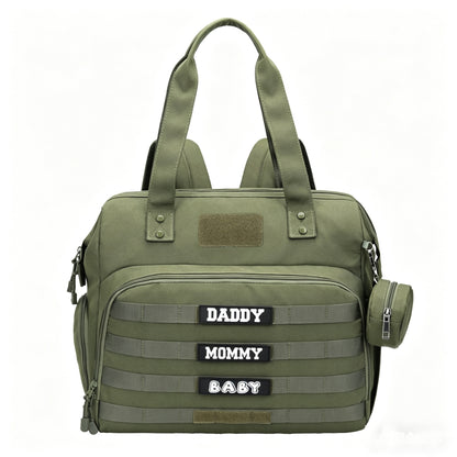 olive green tactical diaper bag tote with front organizer pocket webbing rows carrying handles and round pacifier pouch