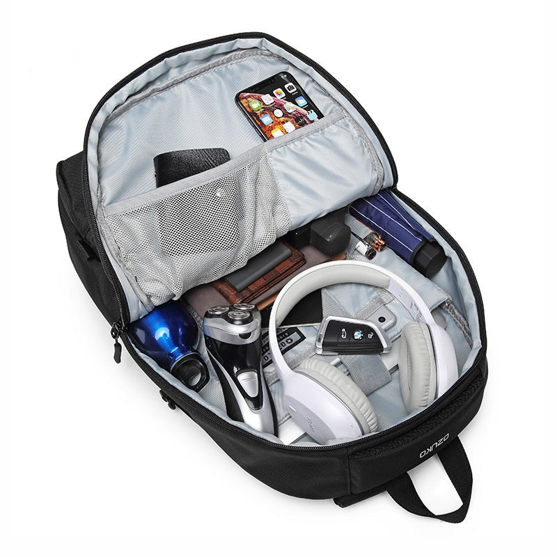 organized laptop backpack interior with divided storage for headphones bottle phone wallet and daily essentials