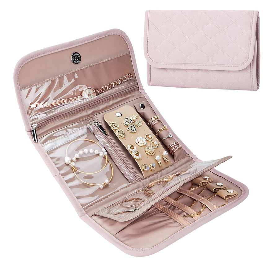pink foldable travel jewelry storage pouch shown closed and open with transparent pockets earring organizer and ring straps