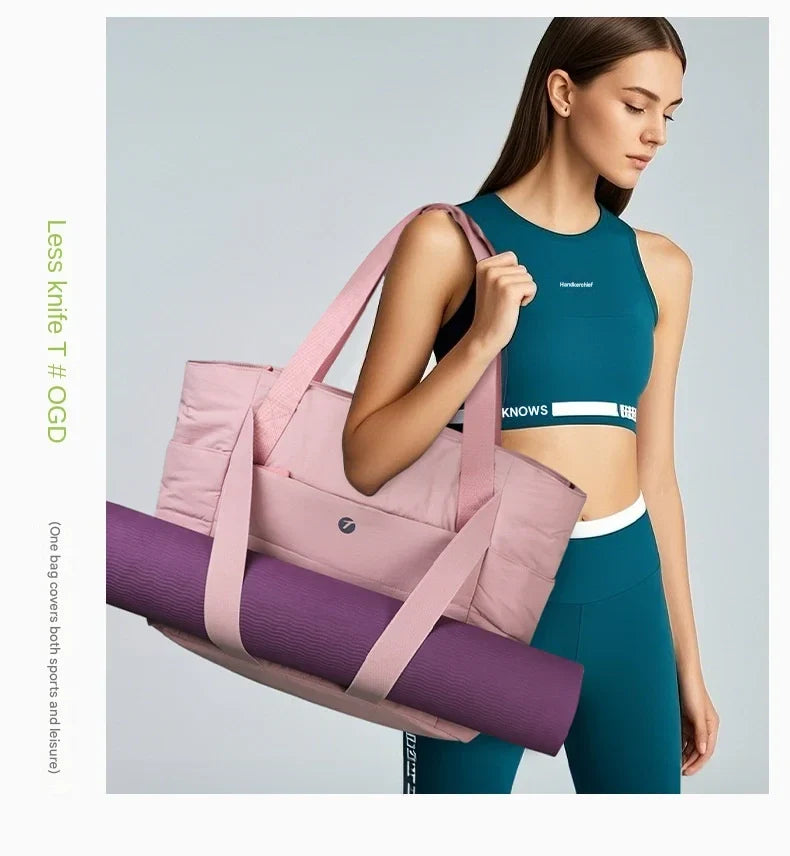 pink travel tote bag carrying a yoga mat with external support straps