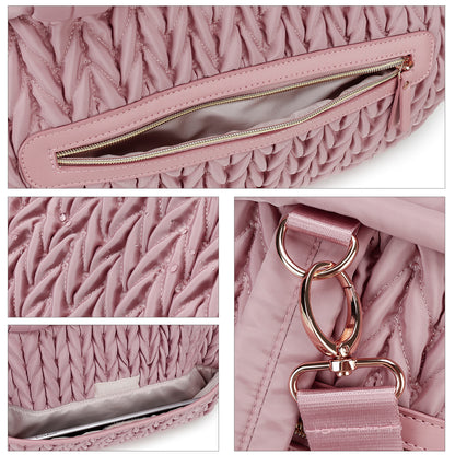 polyester diaper tote detail showing zipper pocket water-resistant quilted surface and metal strap hook