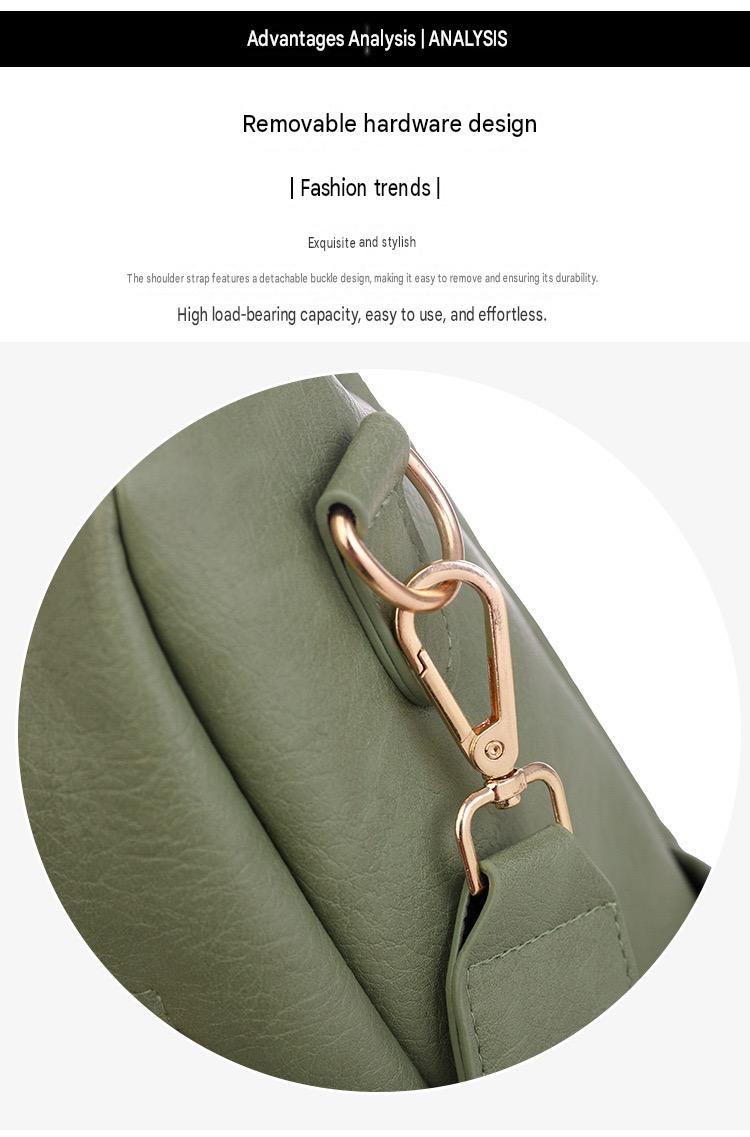 close up of detachable gold tone swivel hook connecting the shoulder strap to a green pu backpack