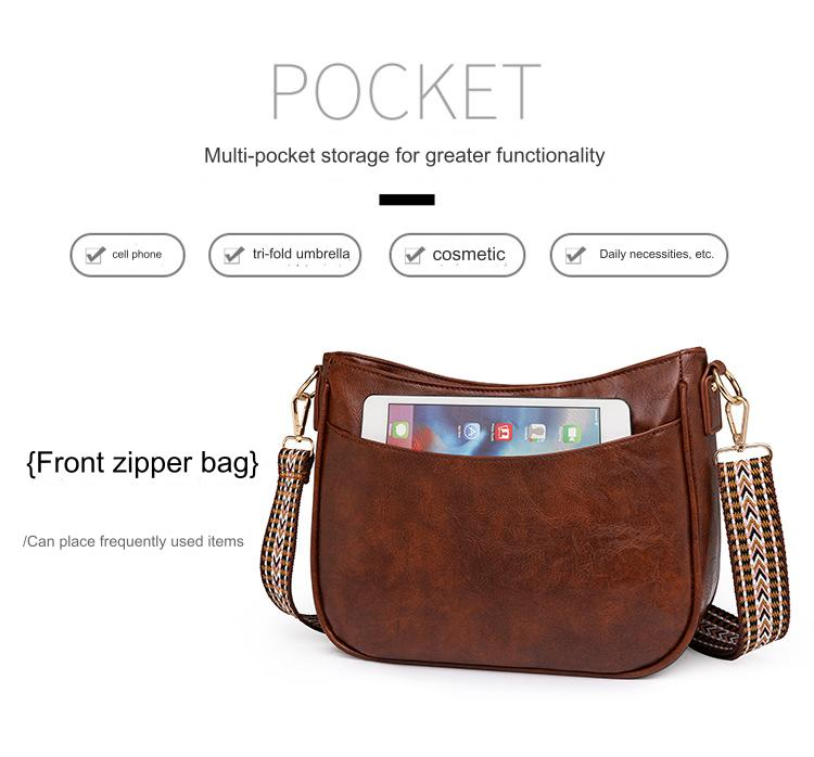 brown pu shoulder bag front slip pocket shown holding a small tablet for quick access storage