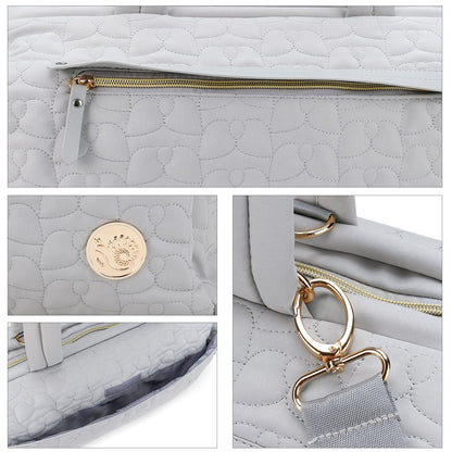quilted diaper bag with premium zipper and strap hardware details