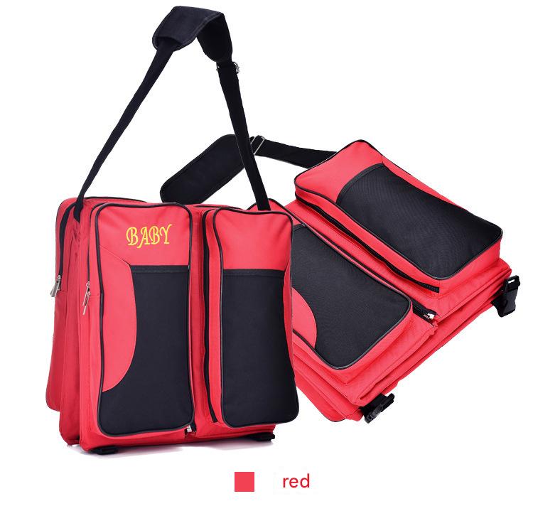 red diaper bag with changing pad