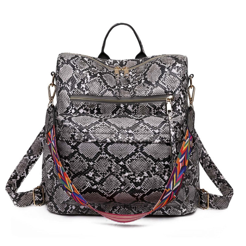 gray snake pattern womens backpack with two front zipper compartments and colorful shoulder strap