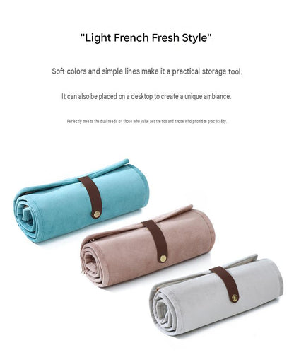 three color roll up jewelry organizer collection in light blue powder brown and greige with contrasting brown closure straps