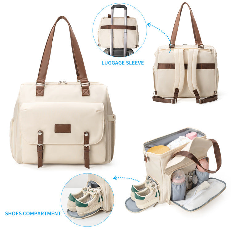 travel diaper bag tote showing separate shoe compartment rear luggage sleeve and opened baby supplies storage