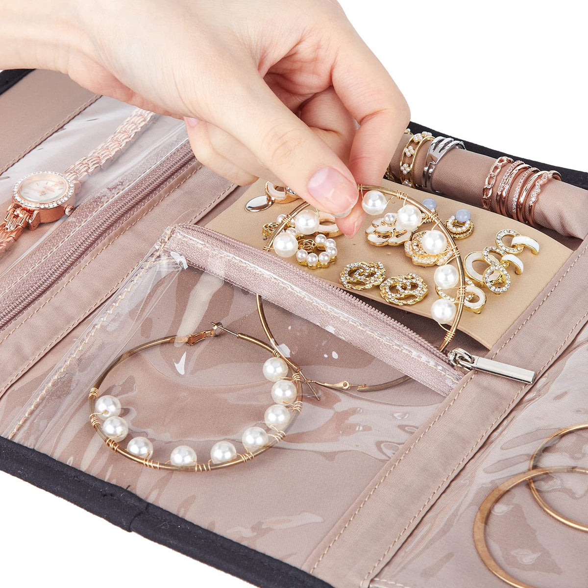 open travel jewelry organizer with transparent PVC zipper pocket earring panel and bracelet storage shown in close-up