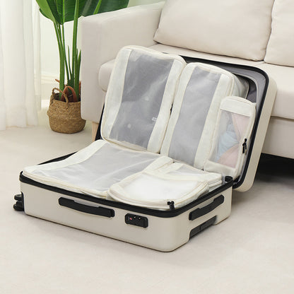 travel organizer bags arranged inside a suitcase to separate clothing and small items