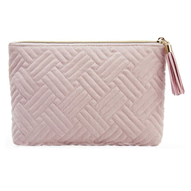soft pink velvet makeup bag with quilted design and tassel zipper