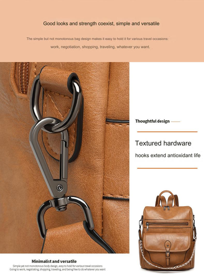 close-up of brown vintage women's backpack shoulder strap attachment with metal-look swivel hook ring and stitched fabric tab