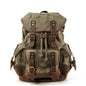 army green canvas backpack with leather accents for outdoor travel and hiking