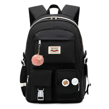 black school backpack with pink fur ball accessory and front organizer pockets