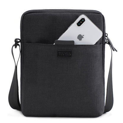 black vertical polyester crossbody bag with front phone pocket adjustable shoulder strap and rectangular slim design
