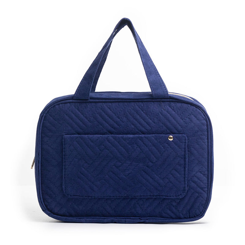 blue quilted makeup bag for travel and daily organization