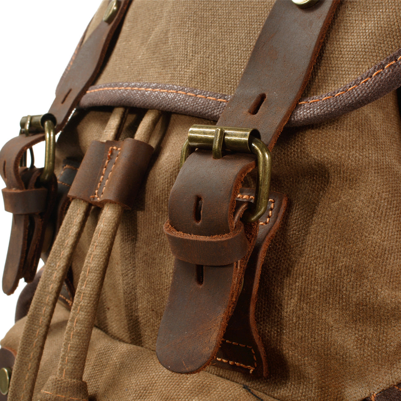 genuine leather buckle detail on washed canvas backpack